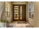 Modern front door with glass panels and sleek hardware at 1509 Winslow St, Las Vegas, NV 89117