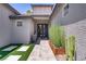 Charming front entrance with modern landscaping, artificial grass, and an elegant contemporary door at 1509 Winslow St, Las Vegas, NV 89117