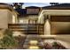 Charming front exterior with a modern gate, illuminated steps, and desert landscaping at 1509 Winslow St, Las Vegas, NV 89117