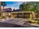 Exterior home view with a three car garage and attractive landscaping at 1509 Winslow St, Las Vegas, NV 89117