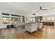 Open-concept living room with modern furniture, sleek ceiling fan and hardwood floors at 1509 Winslow St, Las Vegas, NV 89117