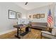 Office with modern desk, comfortable seating, natural light, and hardwood floors at 1509 Winslow St, Las Vegas, NV 89117