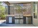 Well-equipped outdoor kitchen features a stainless steel grill, fridge, and prep area at 1509 Winslow St, Las Vegas, NV 89117