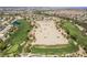 Expansive aerial view showcasing a manicured golf course amid a residential community at 151 Duckhook Ave, Las Vegas, NV 89148