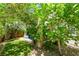 Green backyard featuring lush trees and plants, offering a tranquil outdoor retreat at 151 Duckhook Ave, Las Vegas, NV 89148