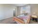 Inviting bedroom filled with natural light from bright window, complemented by plush carpet, creating a tranquil retreat at 151 Duckhook Ave, Las Vegas, NV 89148