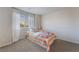 Cozy bedroom featuring a twin bed, bright window, and neutral decor creating a calm and inviting space at 151 Duckhook Ave, Las Vegas, NV 89148