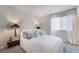 Comfortable bedroom with plush bedding, stylish lamps, and soft natural light for a peaceful and relaxing ambiance at 151 Duckhook Ave, Las Vegas, NV 89148