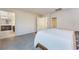 Spacious bedroom with carpet, a view of the ensuite bathroom, and a comfortable aesthetic at 151 Duckhook Ave, Las Vegas, NV 89148