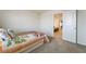 Neutral bedroom with doorway, plush carpeting, and comfortable bed, creating a cozy and welcoming atmosphere at 151 Duckhook Ave, Las Vegas, NV 89148