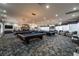 Expansive billiard room with multiple pool tables, stylish lighting, and comfortable seating areas at 151 Duckhook Ave, Las Vegas, NV 89148