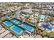 Aerial view of resort-style amenities including pools, tennis courts, and a water park area at 151 Duckhook Ave, Las Vegas, NV 89148