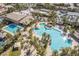 Aerial view of community pool area with multiple pools, cabanas, palm trees, and sunbathing areas at 151 Duckhook Ave, Las Vegas, NV 89148