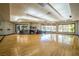 Well-lit fitness room featuring hardwood floors, ample natural light, and various workout equipment at 151 Duckhook Ave, Las Vegas, NV 89148
