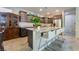 Modern kitchen featuring granite countertops, an island with bar seating, and stainless steel appliances at 151 Duckhook Ave, Las Vegas, NV 89148