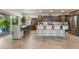 Modern kitchen with stainless steel appliances, granite countertops, and a spacious island with bar seating at 151 Duckhook Ave, Las Vegas, NV 89148