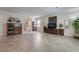 Cozy living room featuring neutral walls and tiled floors with ample space for comfortable seating at 151 Duckhook Ave, Las Vegas, NV 89148