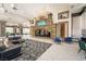 Upscale lobby features a stone fireplace, comfortable seating, and modern lighting creating an inviting space at 151 Duckhook Ave, Las Vegas, NV 89148