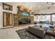Grand lobby with a stone fireplace, elegant seating, and sophisticated decor for a welcoming ambiance at 151 Duckhook Ave, Las Vegas, NV 89148