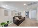 Bright loft space with neutral carpet, a comfortable sofa, and large windows, perfect for relaxation at 151 Duckhook Ave, Las Vegas, NV 89148