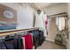 Organized walk-in closet offering ample storage for clothing and accessories with overhead shelving and hanging rods at 151 Duckhook Ave, Las Vegas, NV 89148
