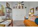 Comfortable bedroom with a ceiling fan, built in shelving, and a plush bed with closet at 1604 Imperial Cup Dr, Las Vegas, NV 89117