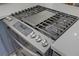 Close up shot of a gas cooktop, featuring many burners and stainless knobs at 1604 Imperial Cup Dr, Las Vegas, NV 89117