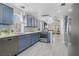 Spacious kitchen boasts stainless steel appliances and views to the living room at 1604 Imperial Cup Dr, Las Vegas, NV 89117