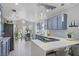 Stylish kitchen featuring a gas cooktop, pendant lighting and barstool seating at 1604 Imperial Cup Dr, Las Vegas, NV 89117