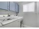 Convenient laundry room with washer, dryer, and overhead storage at 1604 Imperial Cup Dr, Las Vegas, NV 89117