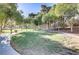 Picturesque park area with walking path, benches, and lush green grass at 1604 Imperial Cup Dr, Las Vegas, NV 89117
