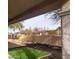 The backyard boasts a charming decorative metal arch and a faux grass patch at 1652 Black Fox Canyon Rd, Henderson, NV 89052