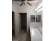 Bathroom features a vanity and a doorway leading to a walk-in closet at 1652 Black Fox Canyon Rd, Henderson, NV 89052