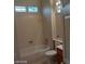 Bathroom featuring a shower and tub combo and a wood vanity at 1652 Black Fox Canyon Rd, Henderson, NV 89052