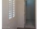 Bedroom featuring a window with white shutters at 1652 Black Fox Canyon Rd, Henderson, NV 89052