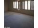 Bedroom featuring carpet and multiple shuttered windows at 1652 Black Fox Canyon Rd, Henderson, NV 89052