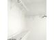 A walk-in closet with white shelving and rods for optimal storage at 1652 Black Fox Canyon Rd, Henderson, NV 89052