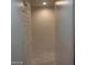 Neutral hallway with tile flooring and white doors at 1652 Black Fox Canyon Rd, Henderson, NV 89052