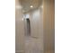 Hallway with neutral paint and tile flooring at 1652 Black Fox Canyon Rd, Henderson, NV 89052