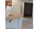 Bright kitchen with white cabinets and stainless steel appliances at 1652 Black Fox Canyon Rd, Henderson, NV 89052