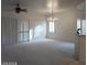 Open living room with shuttered windows, chandelier, and spacious feel, great for entertaining at 1652 Black Fox Canyon Rd, Henderson, NV 89052