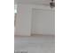 Bright living room with neutral paint, ceiling fan, and tile flooring at 1652 Black Fox Canyon Rd, Henderson, NV 89052