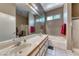 Bathroom featuring double sinks, a soaking tub, and a separate shower at 1717 Dwayne Stedman Ave, Las Vegas, NV 89106