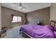 Cozy bedroom featuring carpet floors, a ceiling fan, and a window at 1717 Dwayne Stedman Ave, Las Vegas, NV 89106