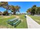 Community green space with a picnic table and winding walkways offering residents a relaxing outdoor experience at 1717 Dwayne Stedman Ave, Las Vegas, NV 89106