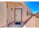 Inviting front entrance with a white door and brick-lined walkway, under a clear, bright blue sky at 1717 Dwayne Stedman Ave, Las Vegas, NV 89106