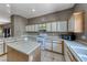 Well-lit kitchen featuring white appliances, countertop space, and an island at 1717 Dwayne Stedman Ave, Las Vegas, NV 89106