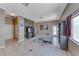 Bright living area with tile floors, neutral paint, and abundant natural light from large windows at 1717 Dwayne Stedman Ave, Las Vegas, NV 89106