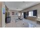 Bright living area with tile floors, neutral paint, and abundant natural light from large windows at 1717 Dwayne Stedman Ave, Las Vegas, NV 89106