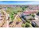 Elevated backyard view of pool in a private residence with a walking path next to a natural desert landscape at 1727 Sonoran Bluff Ave, Henderson, NV 89014